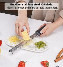 img 2 attached to KANKAN Cheese Grater & Lemon Zester - Parmesan, Ginger, Garlic, Chocolate - Razor-Sharp Stainless Steel Blade - Ideal for Vegetables, Fruits - Includes Protective Cover, Cleaning brush - Dishwasher Safe - Black