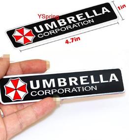 img 1 attached to Шильдик-эмблема автомобиля YSpring Resident Evil Umbrella Corporation из металла - наклейка на багажник - прямоугольное исполнение для автомобилей, мотоциклов и ноутбуков (стиль C, 4,7 дюйма х 1 дюйм, 1 штука)