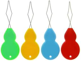 img 1 attached to 🧵 Удобные 24-штучные пластиковые ушкоопаливатели в форме избы в прозрачном футляре - идеальный швейный инструмент для рукоделия, 4 случайных цвета.