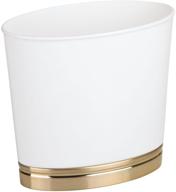 compact and stylish mdesign oval trash can for bathrooms, kitchens, offices, dorms - white/soft brass logo