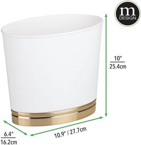 img 1 attached to Compact and Stylish mDesign Oval Trash Can for Bathrooms, Kitchens, Offices, Dorms - White/Soft Brass