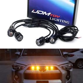 img 4 attached to 🚘 iJDMTOY 4pc High Power LED Grille Lighting Kit with Raptor Style design for Toyota FJ Cruiser, 4Runner, Tacoma, etc. 2500K Amber Projector Lens Spot Beam LED Lights