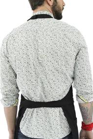 img 1 attached to No-Tie Deep Black Apron - Durable Twill with Leather Reinforcement and Split-Leg - Adjustable Unisex Apron for Professionals: Barbers, Tattoo Artists, Baristas, Bartenders, Bakers, Hair Stylists, Servers