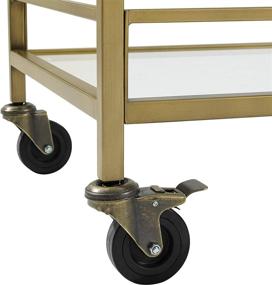 img 1 attached to 🍾 Stylish and Functional Crosley Furniture Aimee Rolling Bar Cart: Gold and Glass Delight!