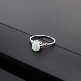 img 1 attached to 💍 Stunning Gem Stone King 925 Sterling Silver and 10K Rose Gold Oval Cabochon White Simulated Opal Women Ring - Exquisite Design with 0.63 Cttw, Various Sizes Available (5, 6, 7, 8, 9)