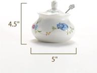 white ceramic sugar bowl with lid and stainless steel spoon - flower design by lionwei lionweli, ideal for home and kitchen use логотип