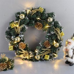 img 4 attached to 🎄 URMAGIC LED Light Up Christmas Wreath Decorations with Pine Balls, Wreath Hanger for Front Door, Xmas Door Wreath (15.7in, Gold) - Enhancing Holiday Spirit and Festive Vibes