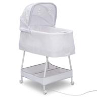 silent auto gliding elite bassinet: delta children odyssey - effortless comfort for your little one! logo