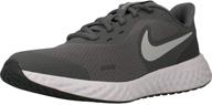 nike revolution 5 grade school running shoe: unisex-child sneakers for optimal performance logo