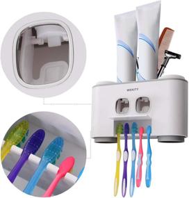 img 2 attached to 🪥 Organization and Convenience in One: Wall-Mounted Toothbrush Holder with Toothpaste Dispenser, 5 Slots, 2 Squeezers, and 4 Cups - Grey
