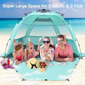 img 2 attached to 🏖️ KO-ON XXL Beach Tent Sun Shelter: Ultimate 4-Person Pop Up Shade with UPF 50+ Protection, Extended Floor, and Extra Side Shade in Purist Blue