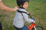 beginner harness for kids: master pedal bike or balance bike riding with a first-ride balance trainer logo