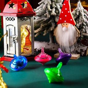 img 1 attached to 🔆 Light-Up Spinning Tops: Hanukkah Musical Toys with LED Lights - Perfect for Christmas Hanukkah Party Favors and Birthday Presents! 4 Assorted Colors