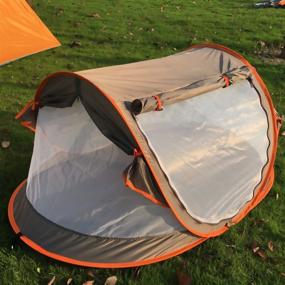 img 1 attached to kilofly большая палатка для путешествий на пляже для малышей с мгновенным складным дизайном, защитой UPF 35+ и 2 колышками для улучшенной стабильности