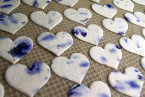 img 1 attached to Set of 50 Handmade Paper Tags with Purple Petals and Embedded Heart Shape Seeds