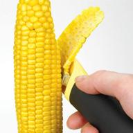 🌽 optimized grip corn peeler, stripper knife for corn, kitchen tool to safely remove corn kernels with vertical serrated blade logo