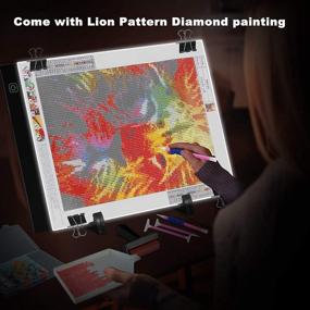 img 1 attached to 💎 Усилите эффект вашей росписи бриллиантами с набором Diamond Painting A4 LED Light Pad в 272 штуки, включающим львиный узор, накладку для отслеживания и полный набор аксессуаров для 5D росписи бриллиантами. Идеально подходит для взрослых и детей, USB-питание включено.