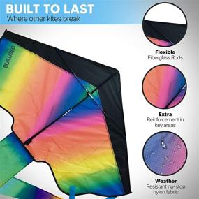 img 1 attached to Premium Animato Large Rainbow Kite for Kids and Adults - Easy to Fly, Fun Outdoor Activity Toy - Rainbow Delta Design - 5 PC Kit with Extra Long String, Storage Bag, and Gloves