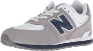 👟 new balance kid's 574 v1 lace-up sneaker: stylish comfort for active kids logo