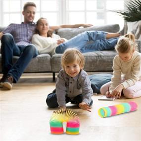 img 1 attached to 🌈 Vibrant Rainbow Plastic Birthday Spring Slinky: Fun and Colorful Party Essential