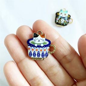 img 1 attached to 🐈 Cartoon Cup Cat Cute Needle Minders: Modern Cross Stitch Embroidery Accessories with Magnetized Holders (2 Pieces)