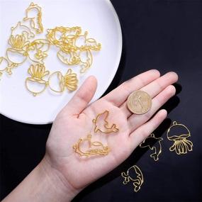 img 1 attached to OLYCRAFT 20pcs Ocean Animal Open Bezel Charms: Color-Lasting Hollow Resin Frames for Stunning Resin Jewelry Making - Gold