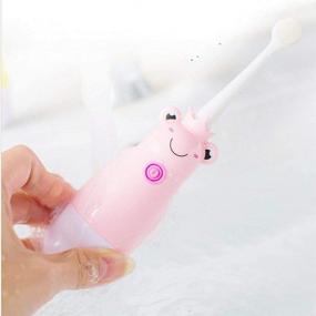 img 2 attached to 🐸 Adorable Waterproof Pink Frog Electric Sonic Children Toothbrush - Ideal for Kids aged 3 to 12 Years - Cute Ultrasonic Design with Three Soft Hair Brushes