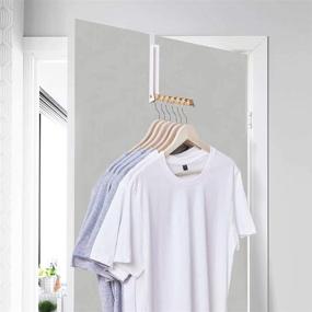 img 1 attached to ELONG HOME Over Door Hanger for Clothes 2 Pack: Space Saving Magnetic Folding Clothes Hook Organizer with 6 Slots - White