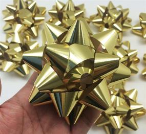 img 3 attached to 🎁 PEPPERLONELY Brand 12PC Peel & Stick Bright Metallic Foil Christmas Confetti Gift Star Bows 4-1/4", Gold - Festive and Shiny Decorative Bows for Holiday Gifts