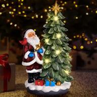 🎄 enhance your holiday décor with handicraft resin sculpture: led lights, battery or usb powered, resin christmas tree with santa claus- tabletop christmas decorations indoor- vintage christmas table top decor logo