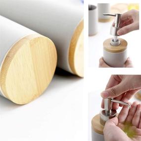 img 1 attached to JIWEIMO 4 Piece Ceramic Bathroom Accessories Set: Soap Dispenser, Toothbrush Holder, Tumbler & Wooden Tray - Version 2.0