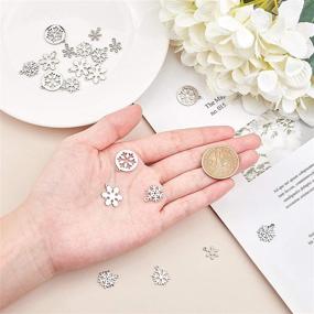 img 3 attached to 🌟 UNICRAFTALE 20pcs Snowflake Pendants, 5 Styles, Metal Charms, Small Hole Stainless Steel Xmas Charms for Christmas DIY Jewelry, Stainless Steel Color