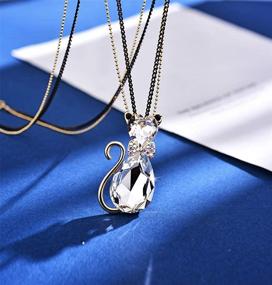 img 1 attached to Rigant Gold Plated Heart Cut & Teardrop Swarovski Elements Crystal Bow Tie Cat Animal Pendant Long Chain Necklace - Elegant Jewelry Statement Piece