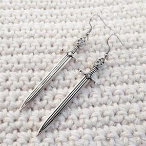 img 2 attached to 🗡️ Vintage Silver Punk Sword Statement Earrings for Women Girls - 4 Pairs Long Sword Hook Earrings, Unique Retro Gothic Knife Dangle Drop Earrings, Gothic Vine Wrapped Hypoallergenic Sword Earrings