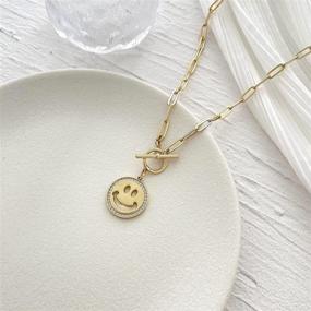 img 1 attached to 18K Matte Gold Plated Paperclip Chain Necklace for Women and Girls with Evil Eye, Smiley Face, and Butterfly Engraved Hammered Coin Pendant - Handmade, 18''