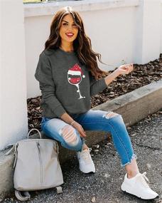 img 1 attached to SUPEYA Women's Christmas Sweatshirt: Red Wine Glass Design with Santa Hat Graphic - Funny Xmas Pullover