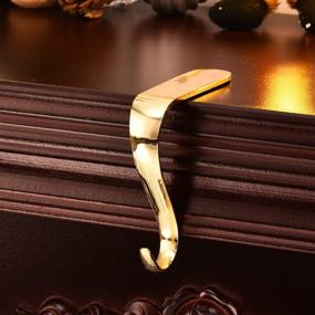 img 1 attached to Pack of 4 Yuokwer Christmas Stocking Holders - Gold Stocking Hooks Hanger for Mantel Fireplace, Safety Hang Grip Stockings Clip for Christmas Party Decoration