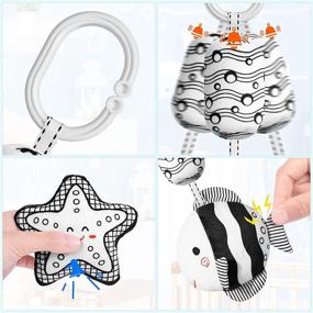 img 2 attached to 👶 Byesuro Baby Hanging Toys: Stuffed Animal Bell Rattle Toys for Infants - Interactive Crinkle Squeaky Toy for Strollers, Cribs, and Car Seats - Newborn Wind Chimes Plush Toy - Black and White Cute Design - Suiting 0-12 Months
