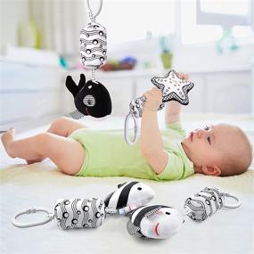 img 3 attached to 👶 Byesuro Baby Hanging Toys: Stuffed Animal Bell Rattle Toys for Infants - Interactive Crinkle Squeaky Toy for Strollers, Cribs, and Car Seats - Newborn Wind Chimes Plush Toy - Black and White Cute Design - Suiting 0-12 Months
