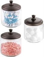 mdesign glass bathroom vanity storage organizer canisters jars - clear/bronze - 3 pack, ideal for cotton balls, swabs, makeup sponges, bath salts, hair ties, and jewelry логотип