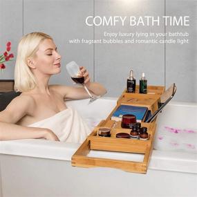 img 3 attached to 🛀 Enhance Your Bathing Bliss with VIVOHOME Expandable 43 Inch Bamboo Bathtub Caddy Tray - Smartphone Tablet Book Holders, Soap Tray, Wine Glass Slot & More!