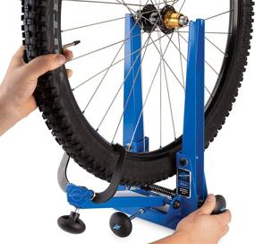 img 3 attached to Park Tool Professional Wheel Truing Stand, Blue: Premier Precision for Perfect Wheel Alignment