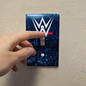 img 2 attached to 🤼 WWE Crowd Logo Plastic Wall Decor Toggle Light Switch Plate Cover by GRAPHICS & MORE: Add a Touch of Wrestling Excitement to Your Room!