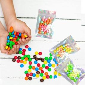 img 3 attached to 🛍️ 100PCS Holographic Resealable Smell Proof Bags - 4 x 6 Inch Flat Reclosable Mylar Ziplock Bags for Party Favors, Food Storage, Coffee, Candy - Aluminum Foil Pouches with Grip Seal Wrap