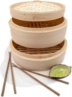 authentic handcrafted 10 inch bamboo steamer - dual layer, perfect for dim sum, bao buns, rice, vegetables, meat & fish - includes 2 sets of chopsticks, 20 liners & sauce dish logo