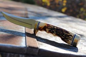 img 2 attached to 🔪 Uncle Henry 153UH Golden Spike: All-Purpose Outdoor Knife for Survival, Camping, and Hunting - 9.25in SS Blade with Rat Tail Tang and Staglon Handle