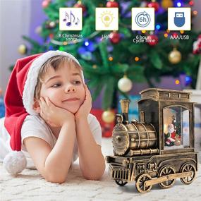 img 2 attached to 🎅 Музыкальные рождественские снежные шары с Санта Клаусом и рождественской ёлкой в шаре поезде - снежный шар с блестками, включающий 8 рождественских музыкальных песен, работающий от батареи и USB, идеальное рождественское украшение дома в подарок.