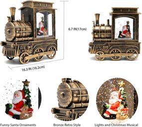 img 3 attached to 🎅 Музыкальные рождественские снежные шары с Санта Клаусом и рождественской ёлкой в шаре поезде - снежный шар с блестками, включающий 8 рождественских музыкальных песен, работающий от батареи и USB, идеальное рождественское украшение дома в подарок.
