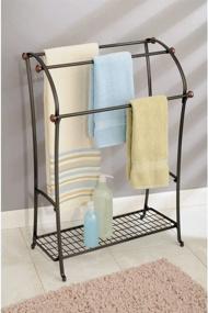 img 3 attached to mDesign Large Freestanding Towel Rack Holder with Storage Shelf - 3 Tier Bronze Organizer for Bath & Hand Towels, Washcloths, Bathroom Accessories - Warm Brown