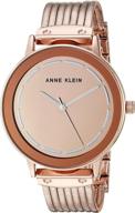 элегантные женские наручные часы anne klein с золотистым браслетом: время с изяществом. логотип